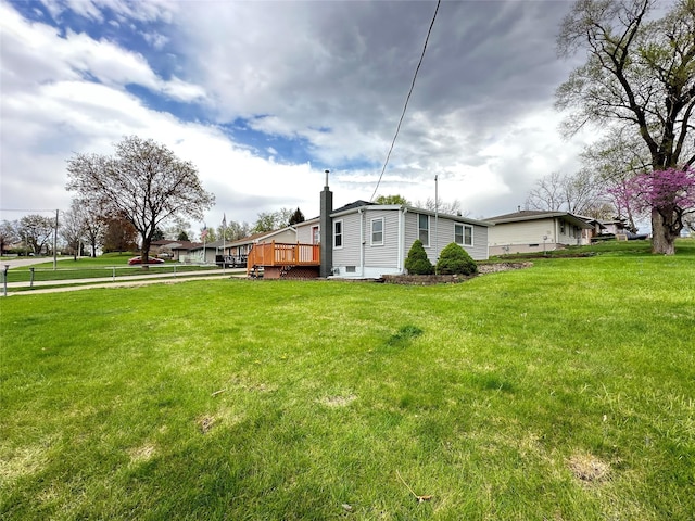 view of yard featuring a wooden deck