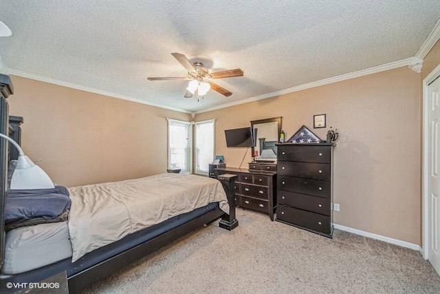 bedroom with a textured ceiling, carpet flooring, ceiling fan, baseboards, and ornamental molding