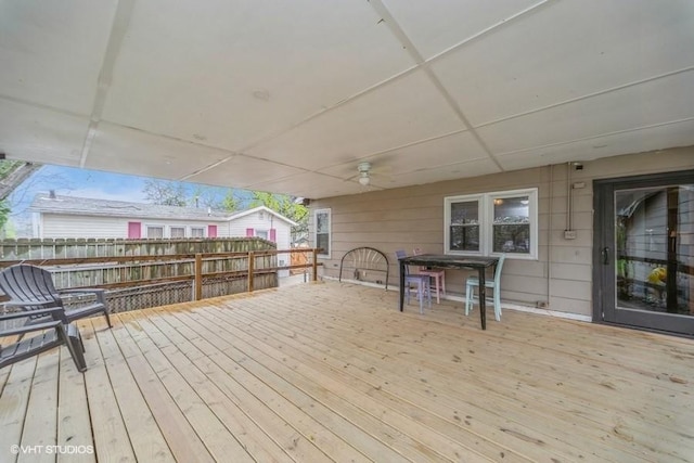 deck with fence, ceiling fan, and outdoor dining area
