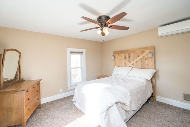 bedroom featuring baseboards, a wall mounted air conditioner, and carpet floors