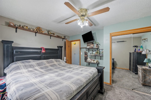 carpeted bedroom featuring a closet, ceiling fan, a textured ceiling, and baseboards