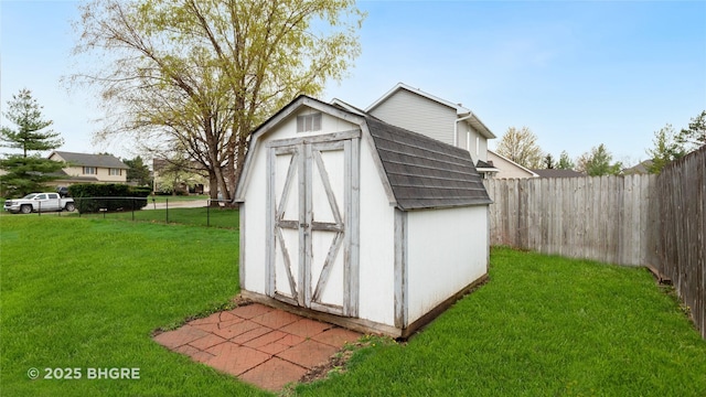 view of shed featuring a fenced backyard
