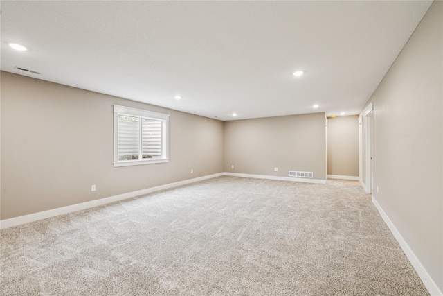 2323 N 8th Ave E, Newton, IA 50208 - spare room with light colored carpet and recessed lighting