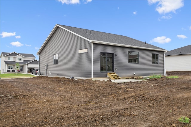 2323 N 8th Ave E, Newton, IA 50208 - rear view of house featuring entry steps