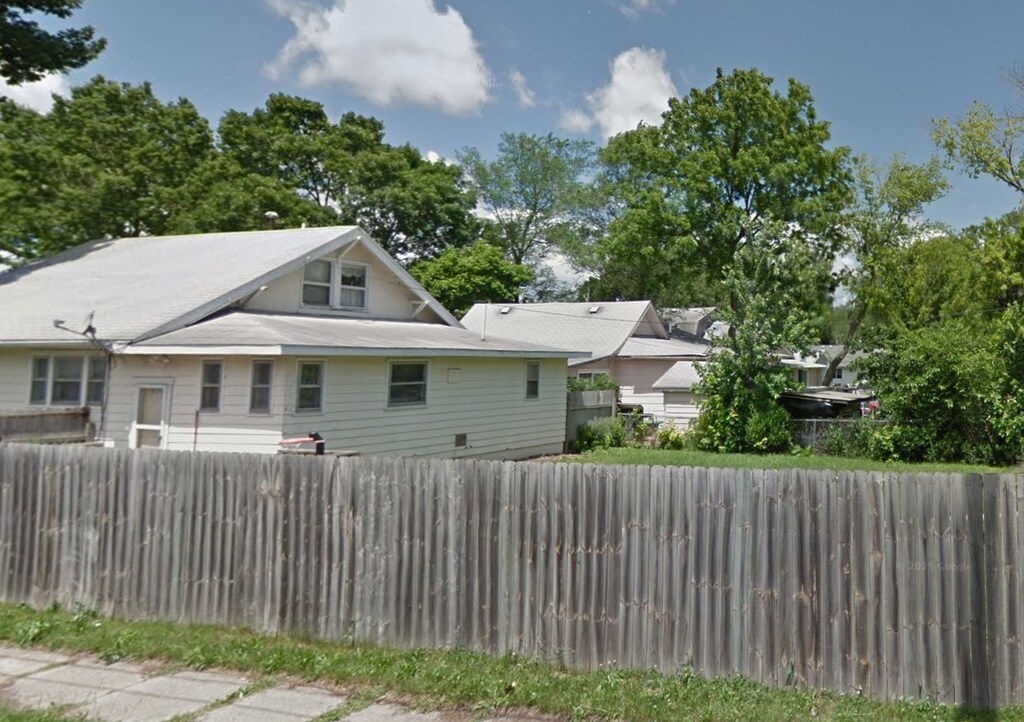back of house featuring fence