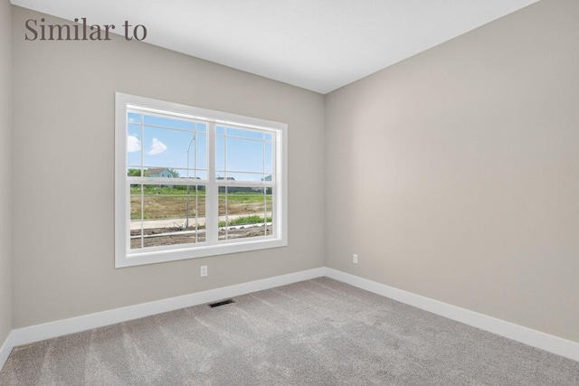 2931 Lake Hill Dr, Des Moines, IA 50320 - carpeted empty room featuring baseboards