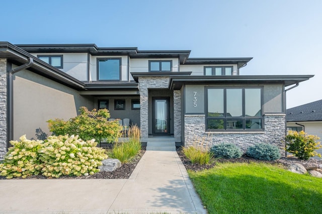 prairie-style house with stucco siding and stone siding