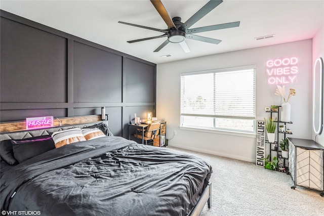 bedroom featuring visible vents, ceiling fan, light carpet, and baseboards