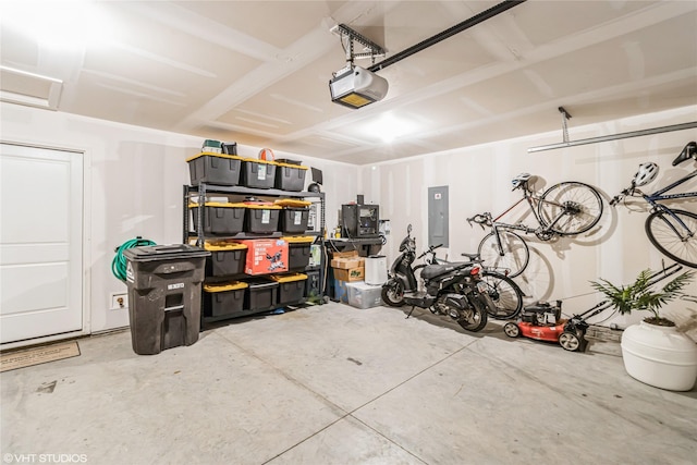 garage featuring a garage door opener and electric panel