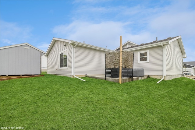 rear view of property featuring an outdoor structure, a lawn, and a storage shed