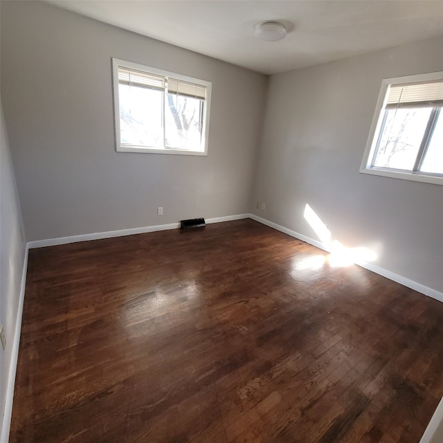 126 E Maxwelton Dr, Des Moines, IA 50315 - spare room featuring dark wood finished floors and baseboards