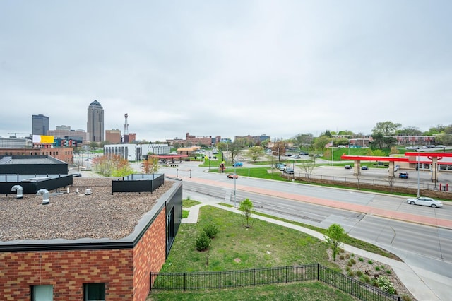 exterior space featuring fence and a city view