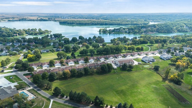 birds eye view of property with a water view and a residential view