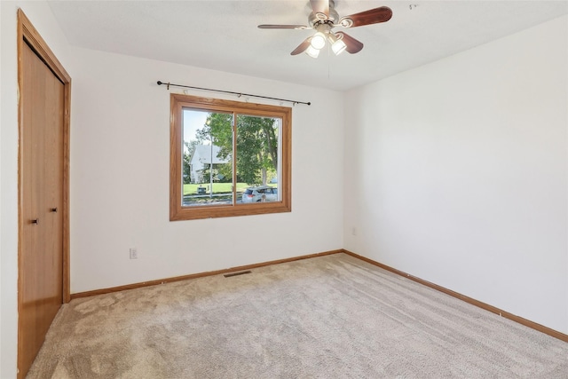unfurnished bedroom with visible vents, carpet floors, and baseboards