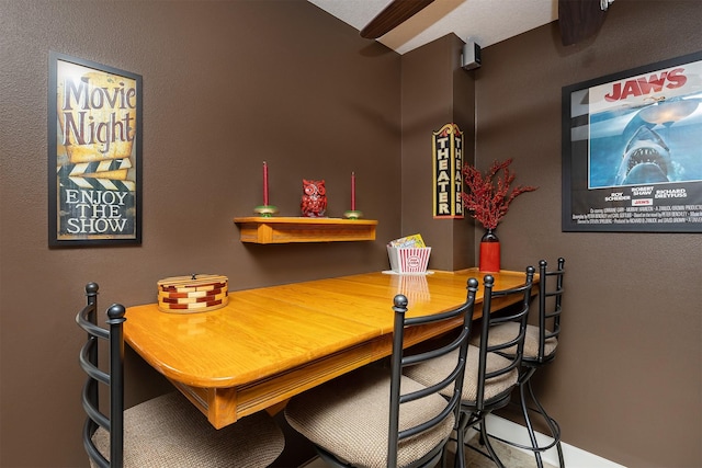 dining space with baseboards