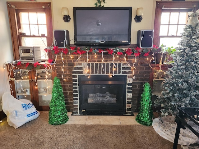 1134 39th St, Des Moines, IA 50311 - interior details featuring a brick fireplace and carpet flooring