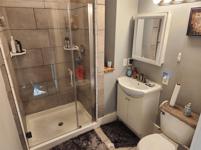 1134 39th St, Des Moines, IA 50311 - bathroom with toilet, a shower stall, and vanity