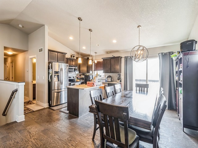 2035 SE Parkview Crossing Dr, Waukee, IA 50263 - dining room featuring vaulted ceiling, recessed lighting, and dark wood-style flooring
