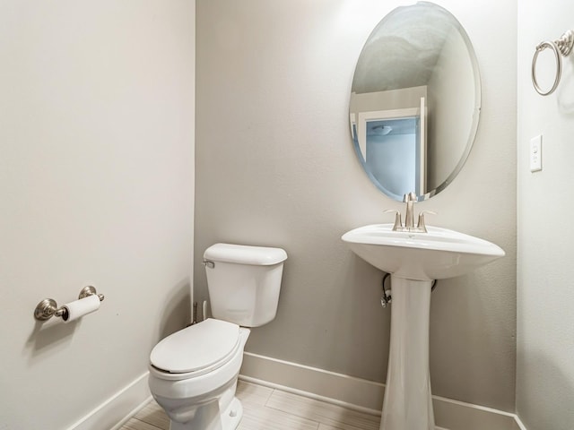 2035 SE Parkview Crossing Dr, Waukee, IA 50263 - half bathroom featuring toilet and baseboards