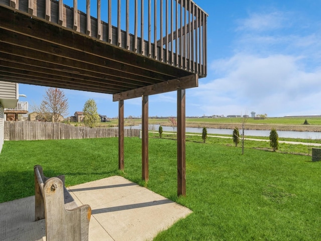 2035 SE Parkview Crossing Dr, Waukee, IA 50263 - view of yard featuring a water view and a patio