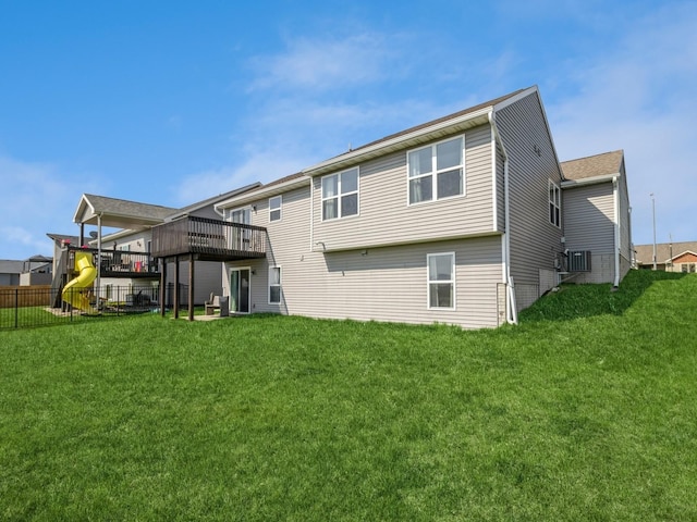 2035 SE Parkview Crossing Dr, Waukee, IA 50263 - back of house with a wooden deck and a playground