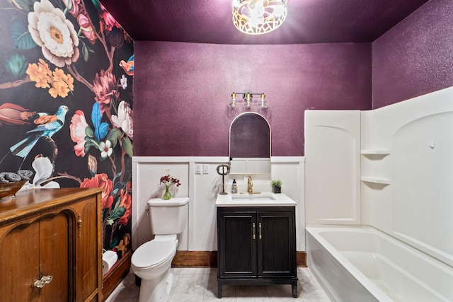 bathroom featuring toilet, tile patterned flooring, and vanity
