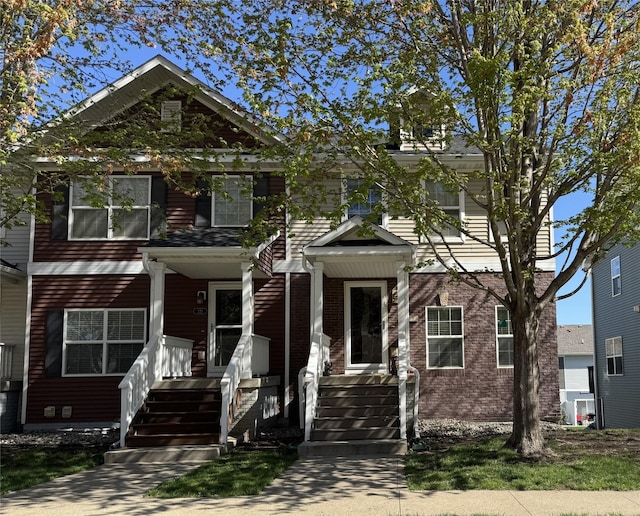 223 SE Booth Ave, Waukee, IA 50263 - view of front of property featuring covered porch and brick siding