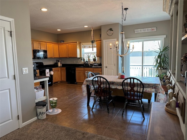 223 SE Booth Ave, Waukee, IA 50263 - dining space with plenty of natural light, dark tile patterned floors, and recessed lighting