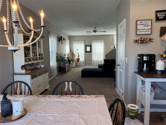 223 SE Booth Ave, Waukee, IA 50263 - carpeted dining room with a ceiling fan and baseboards