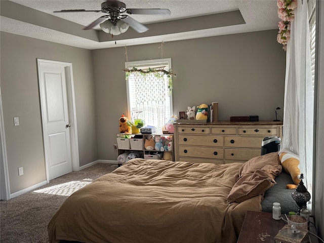 223 SE Booth Ave, Waukee, IA 50263 - carpeted bedroom with a textured ceiling, a ceiling fan, and baseboards