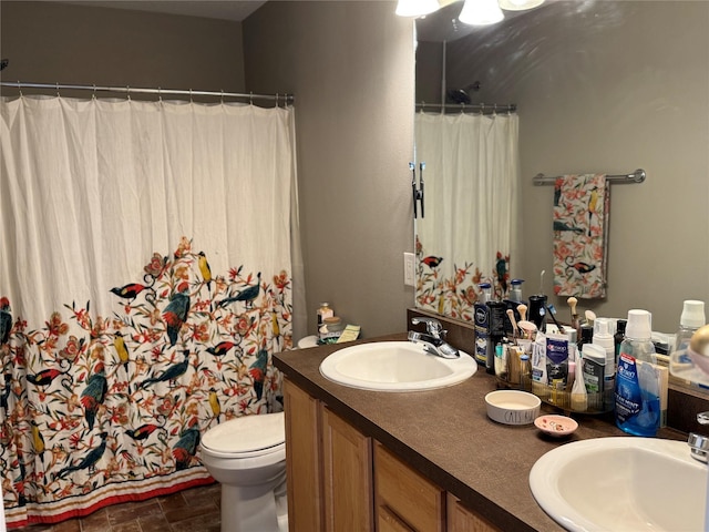 223 SE Booth Ave, Waukee, IA 50263 - bathroom featuring toilet, double vanity, a sink, and curtained shower