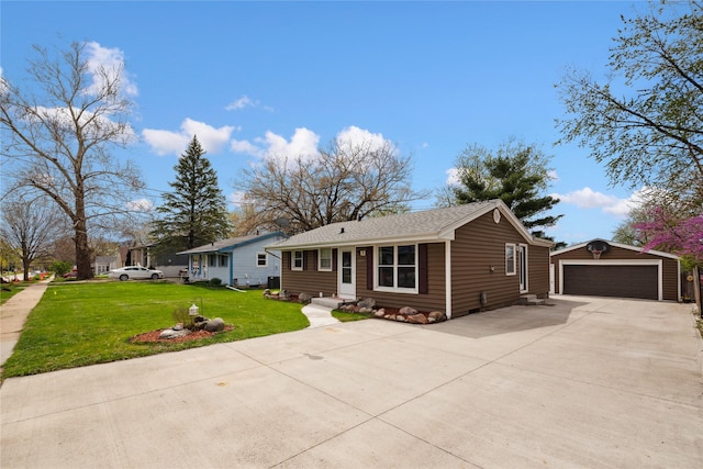 ranch-style house with a detached garage, an outdoor structure, a front lawn, and entry steps