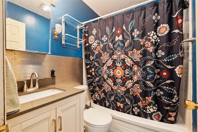 full bath featuring vanity, tasteful backsplash, toilet, visible vents, and shower / tub combo with curtain