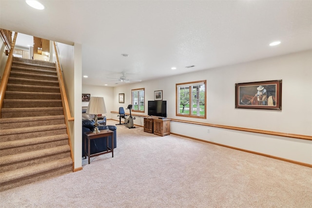 living area featuring recessed lighting, stairs, light colored carpet, baseboards, and visible vents