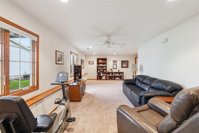 living room featuring light colored carpet, ceiling fan, and recessed lighting