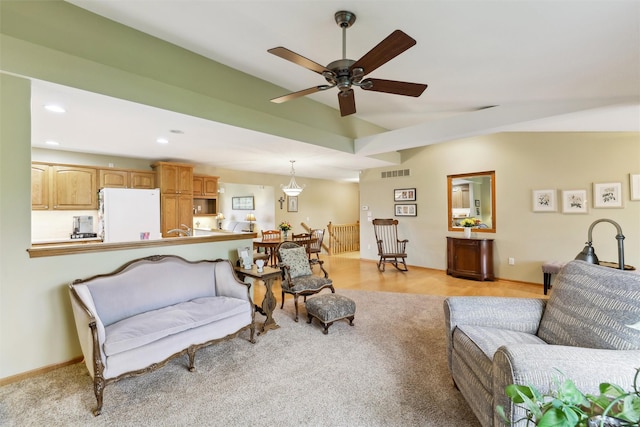 living room with visible vents, light carpet, ceiling fan, and recessed lighting