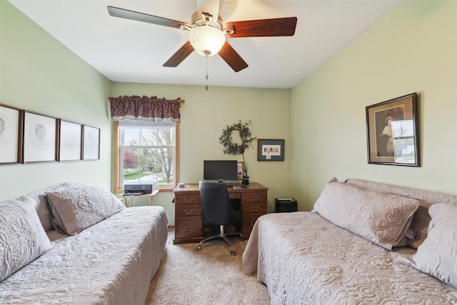 bedroom with ceiling fan and light colored carpet