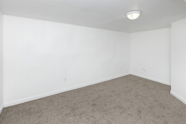 carpeted empty room with baseboards