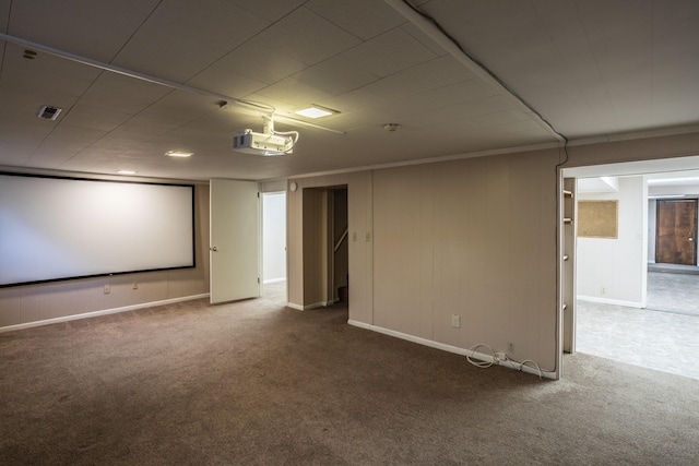 carpeted cinema with visible vents and baseboards