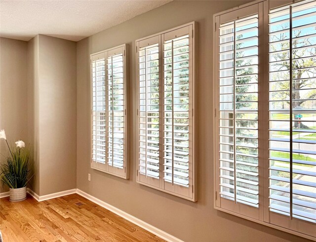 601 41st St, Des Moines, IA 50312 - detailed view of wood finished floors and a textured ceiling