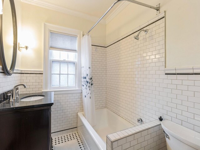 322 49th St, Des Moines, IA 50312 - bathroom with tile walls, crown molding, shower / tub combo, toilet, and vanity