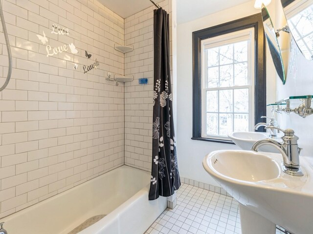 322 49th St, Des Moines, IA 50312 - bathroom featuring tile patterned floors, shower / bath combination with curtain, and healthy amount of natural light