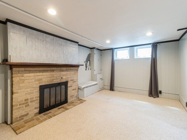 322 49th St, Des Moines, IA 50312 - unfurnished living room with carpet floors, a fireplace, and recessed lighting