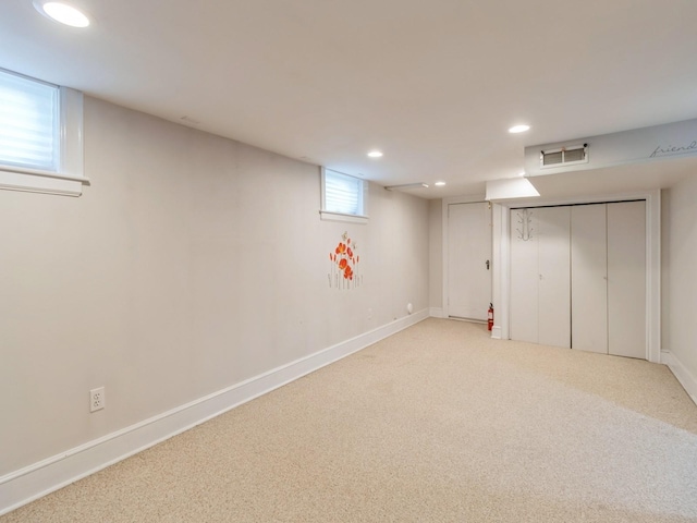 322 49th St, Des Moines, IA 50312 - below grade area with recessed lighting, light colored carpet, and baseboards