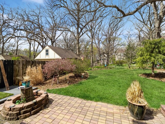 322 49th St, Des Moines, IA 50312 - view of yard featuring a patio area