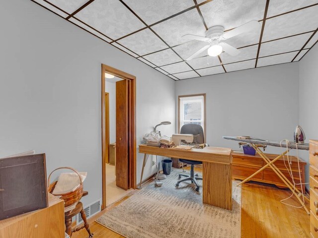 1313 Rose Ave, Des Moines, IA 50315 - home office featuring ceiling fan and wood finished floors