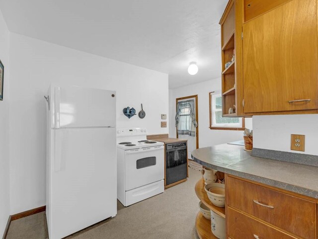 1313 Rose Ave, Des Moines, IA 50315 - kitchen with white appliances, brown cabinets, open shelves, and light colored carpet