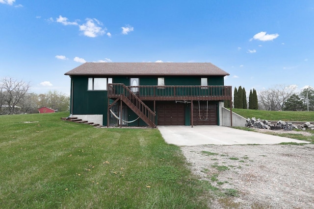 view of front of house featuring a wooden deck, a front lawn, concrete driveway, and an attached garage
