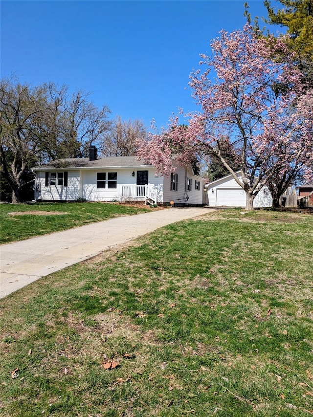 1300 NE 50th Pl, Des Moines, IA 50313 - single story home featuring driveway, a garage, a front yard, and a chimney
