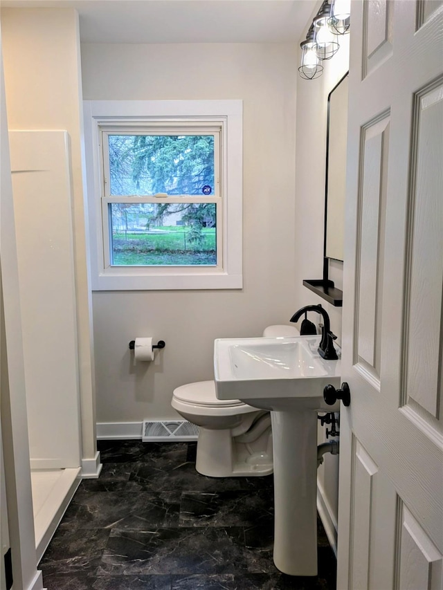1300 NE 50th Pl, Des Moines, IA 50313 - full bathroom with a stall shower and marble look tile flooring
